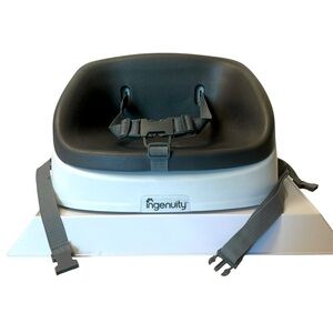 Portable White and Charcoal Gray Booster Seat for Toddler by Ingenuity.